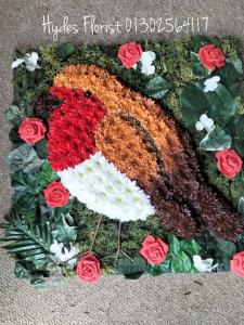 robin red breast in flowers funeral flowers