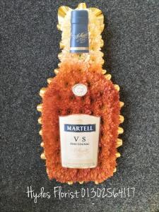 bottle of brandy funeral flowers