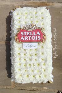 can of stella lager funeral flowers