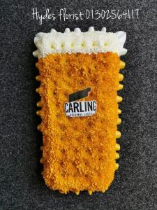 a pint of carling lager in flowers
